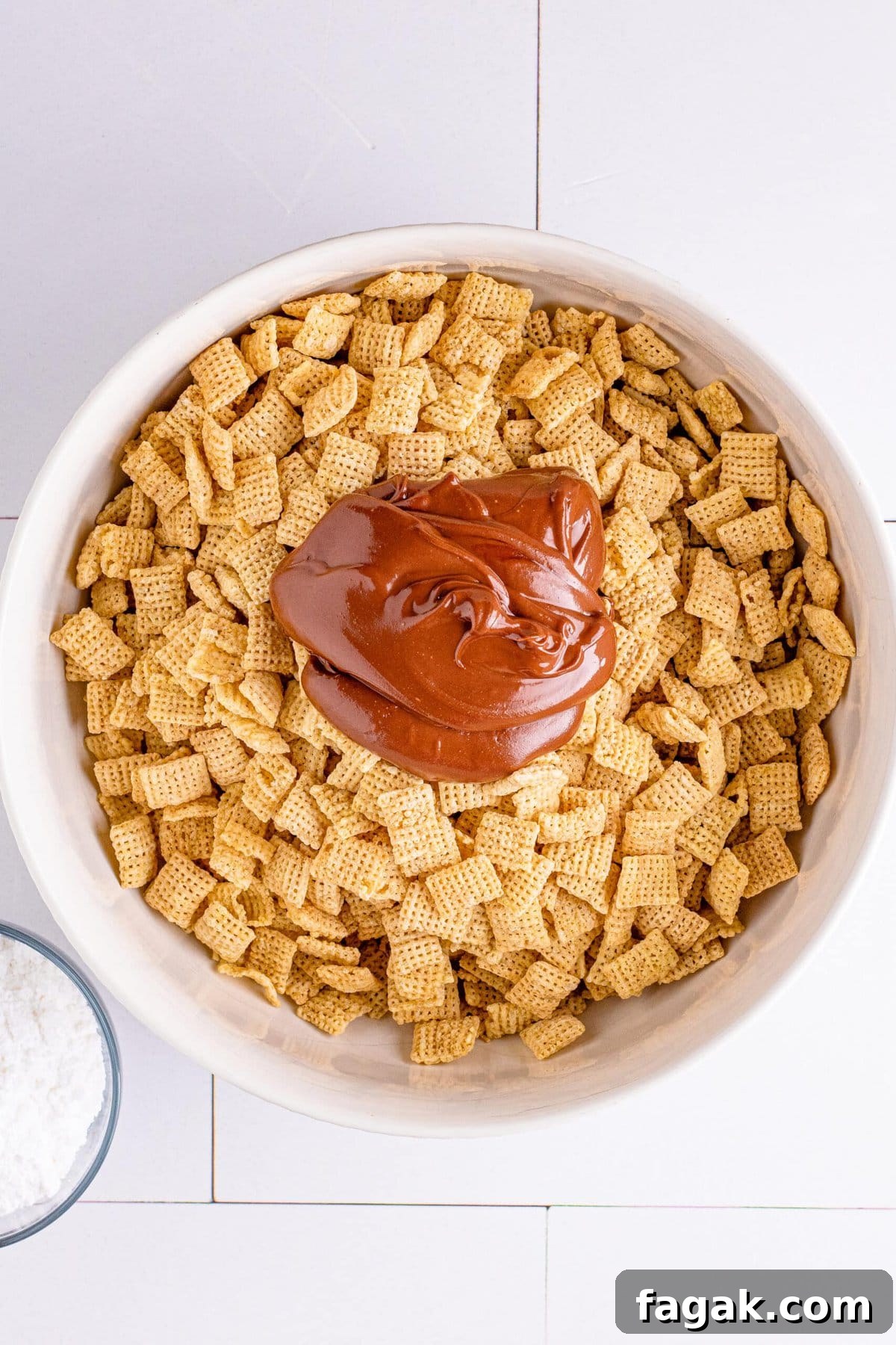 picture of melted chocolate and peanut butter over chex cereal
