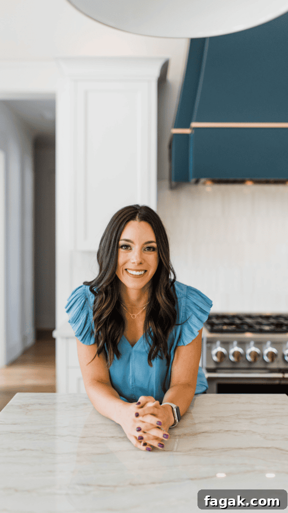 Kacie Barnes Leaning on Kitchen Counter