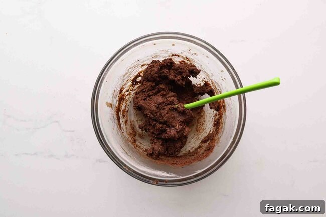 Chocolate cookie dough in a bowl.