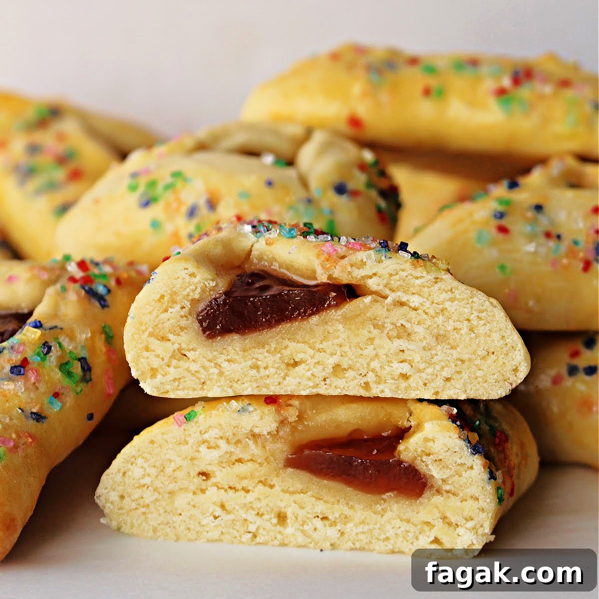 Classic Hamantaschen Recipe for Purim Cookies 7 Closeup of Hamantaschen cookie cut in half to show cakey interior.