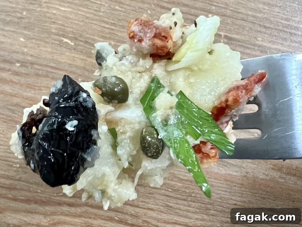 Close up Italian potato salad on fork.